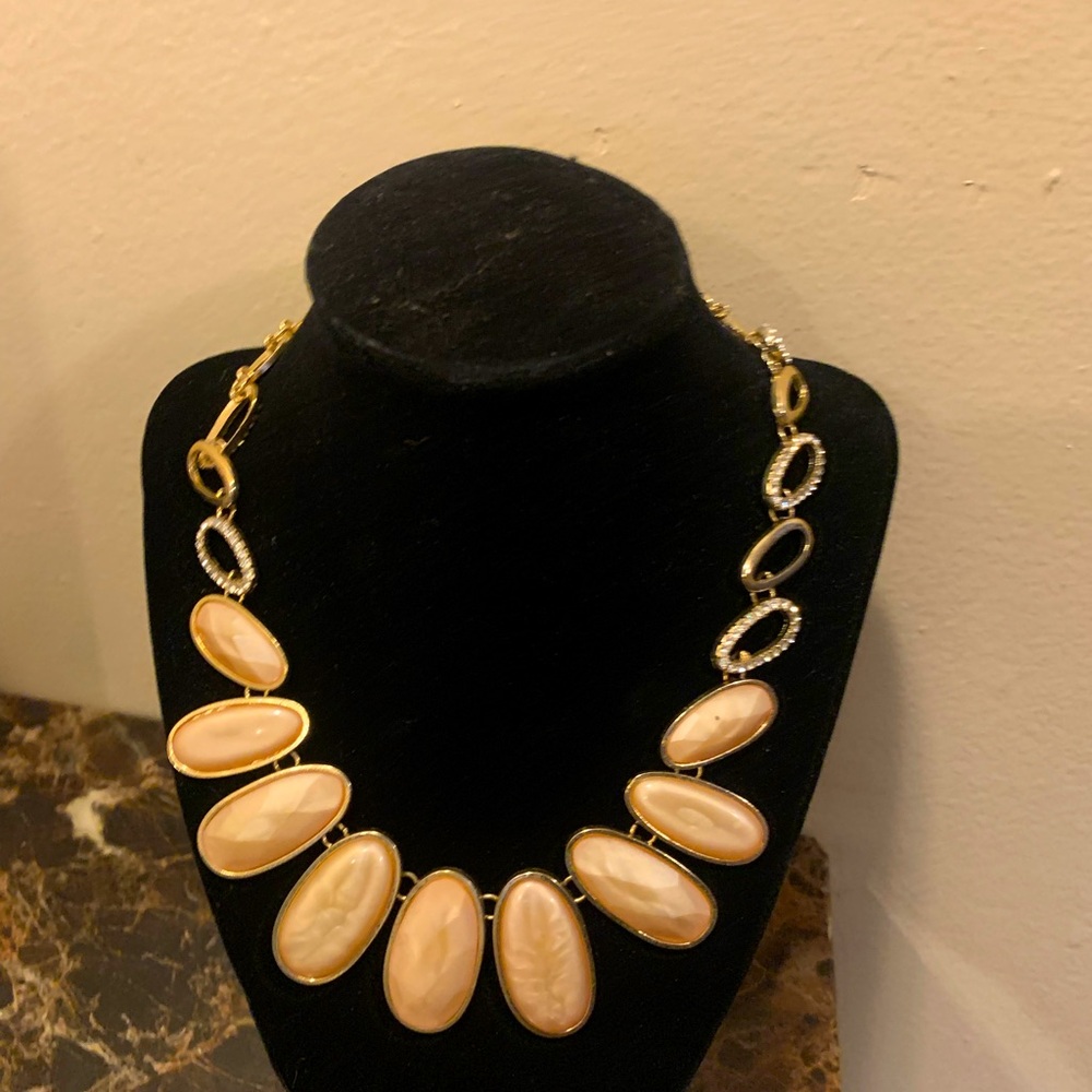 Gold tone statement bib necklace with small rhinestone accents